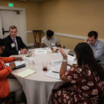 A group analyzes and discusses data points during the "Educator Workforce Policy" session.