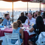 Attendees mingle during dinner at the Hotel del Coronado.