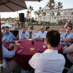 Fellows and resource experts reflect on the day's discussions during dinner on the beach at the Hotel del Coronado.
