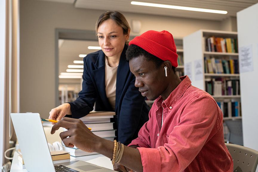 A college professor helping a student